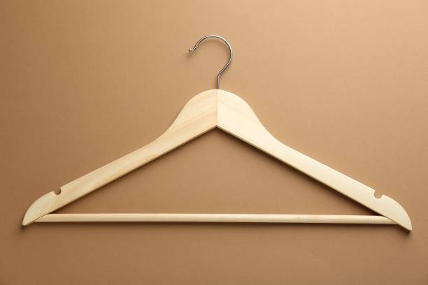 istock Empty wooden hanger on brown background, top view 2180133376