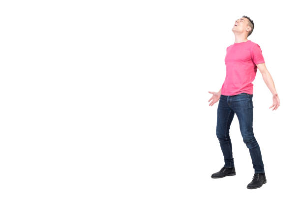 Full body of satisfied and relieved male model exhaling with mouth opened and closed eyes on white background