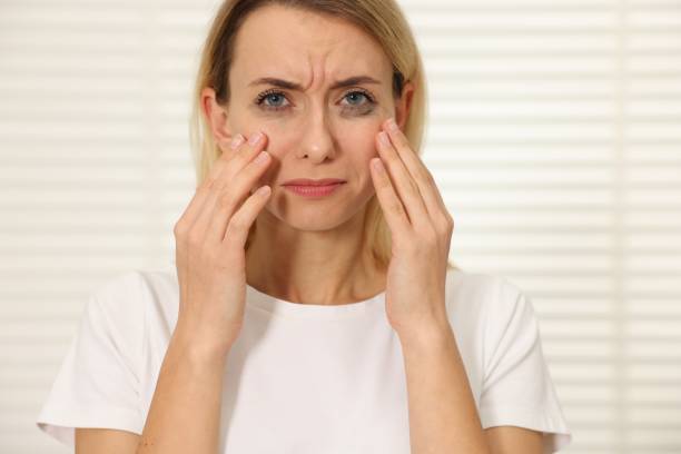 istock Sad woman with smeared mascara crying indoors 2180136589