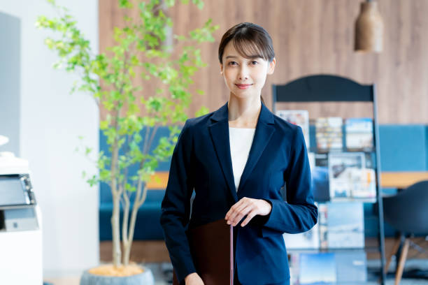 istock A female consultant working at the reception desk 2180139928