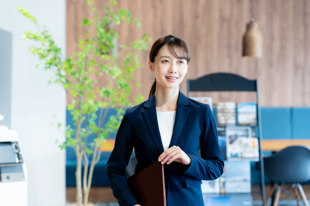 istock A female consultant working at the reception desk 2180139930