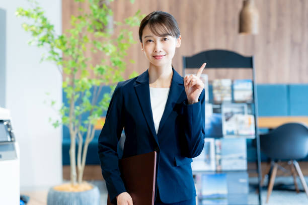 istock A female consultant working at the reception desk 2180139939