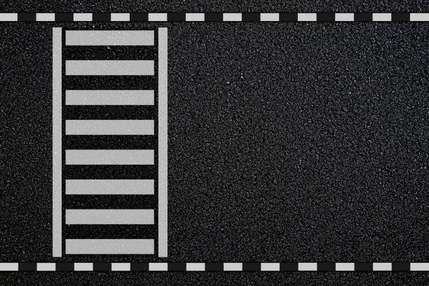 istock Empty crosswalk on asphalt road with black and white sign on sidewalk curb. top view 2180149771