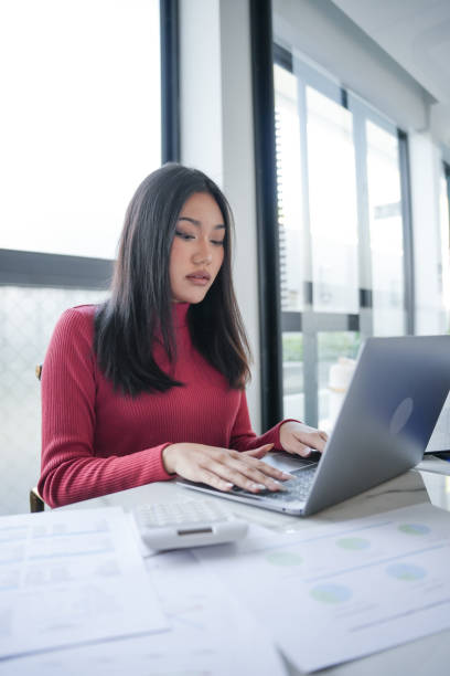 istock Beautiful Business Woman working by using laptop computer Hands typing on keyboard. Professional investor working new start up project. business planning in office. Technology business Concept. 2180150059