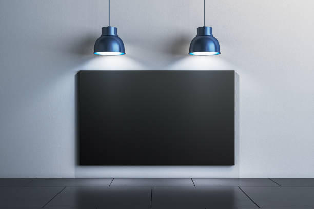 istock Modern gallery wall with a blank canvas illuminated by pendant lights. 3D Rendering 2180150733