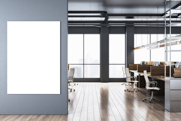 istock Modern office interior with blank poster on wall and large windows overlooking city. 3D Rendering 2180150785