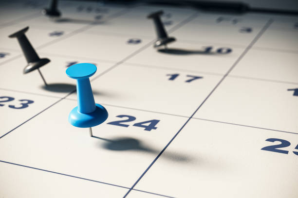 istock Closeup of calendar with colored pins. 3D Rendering 2180150835