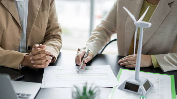 istock Alternative energy environment businesspeople explaining about chart document and renewable energy 2180152442