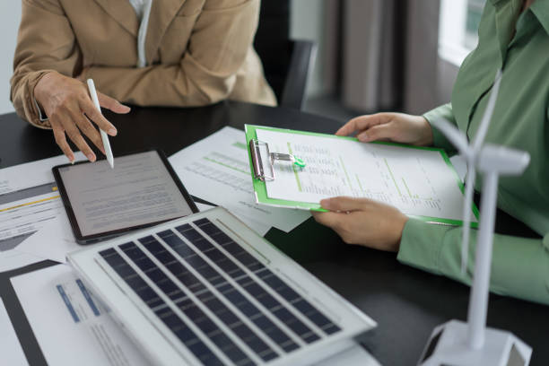 istock Alternative energy environment businesspeople discuss about solar cell panel data and green energy 2180152463