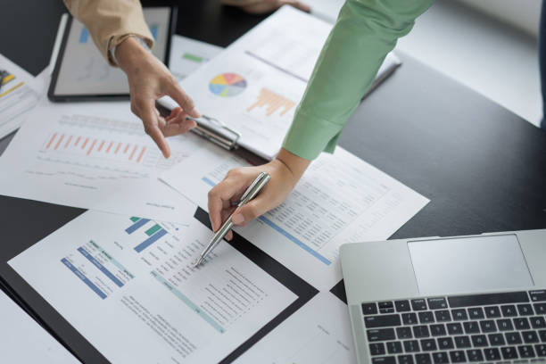 istock Alternative energy environment businesspeople checking document and discuss about renewable energy 2180152479