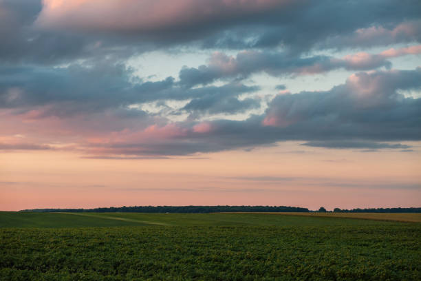Gorgeous textured clouds over farmland and cultivated fields. Agronomic industry. Location place agrarian region of Ukraine, Europe. Perfect photo wallpaper. Fantastic panorama. Beauty of earth.