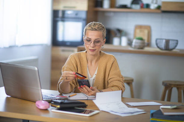 istock Woman doing financial planning at her home 2180156547