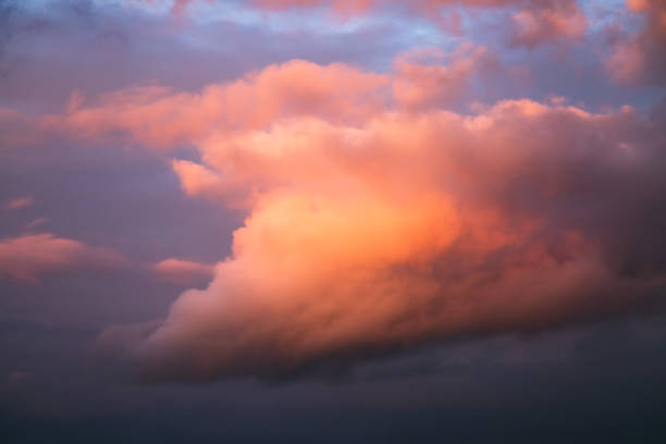 istock An incredible sunset with cumulus clouds glowing in the sunlight. 2180157535