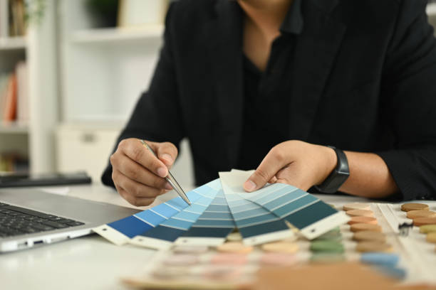 istock An interior designer reviewing a color chart while working on new design project at a desk 2180157720
