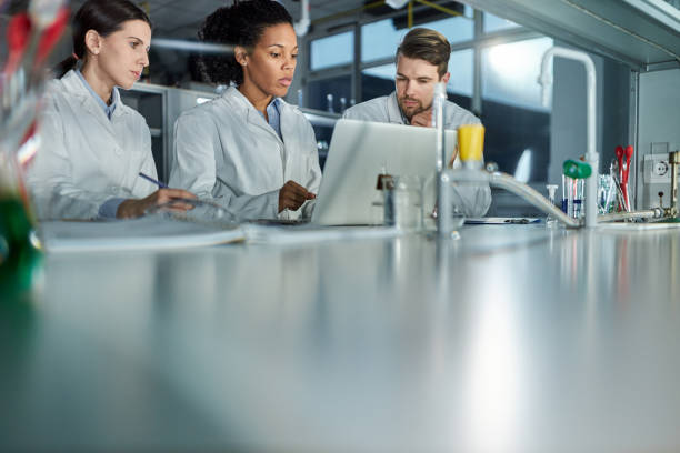 istock Students of science working on laptop in laboratory. 2180157750