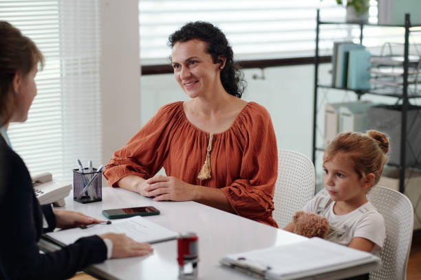 istock Young Mother Having Consultation With Social Worker 2180159562