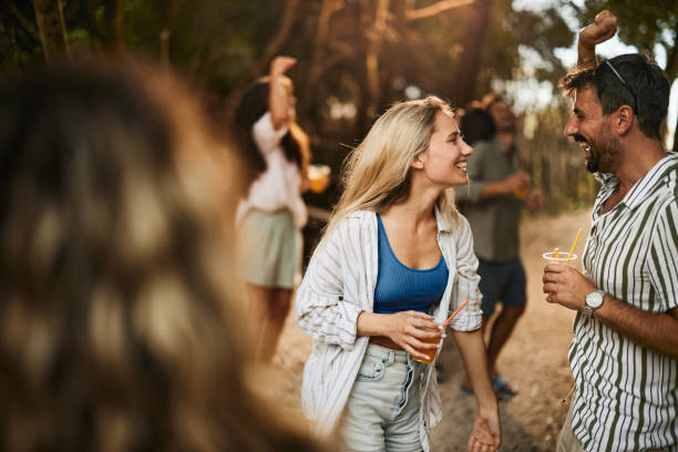 istock Young happy couple having fun on spring party in nature. 2180160355