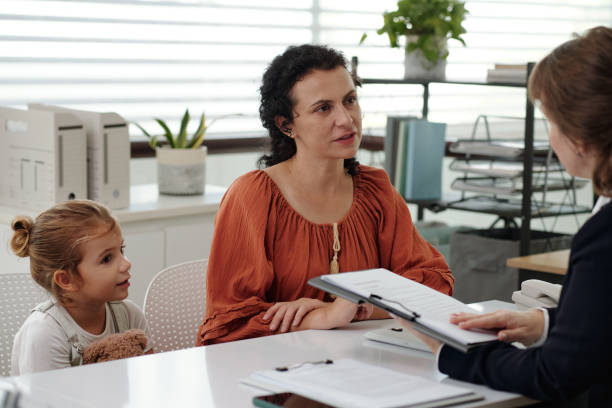 istock Woman Discussing Contract With Social Worker 2180160482