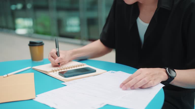 Asian man is busy calculating and preparing tax documents to pay this year