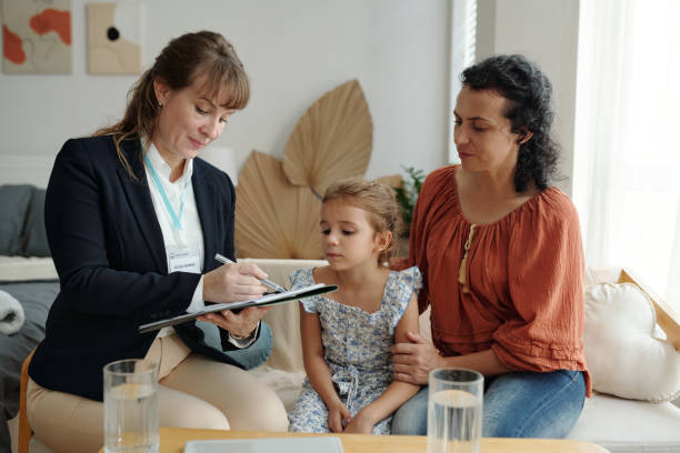 istock Social Worker Visiting To Adoptive Family At Home 2180161945