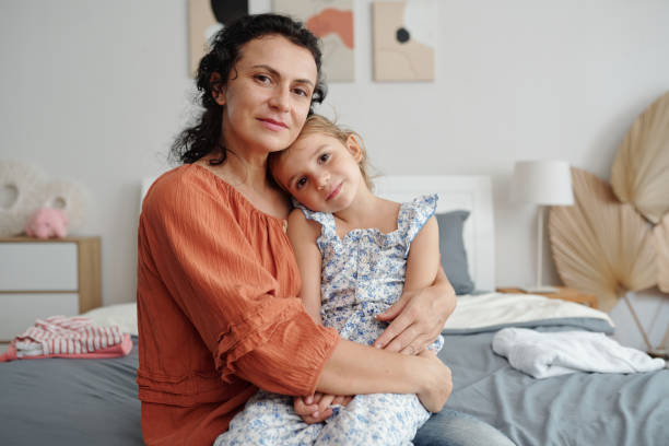 istock Loving Mom With Her Little Daughter 2180165084