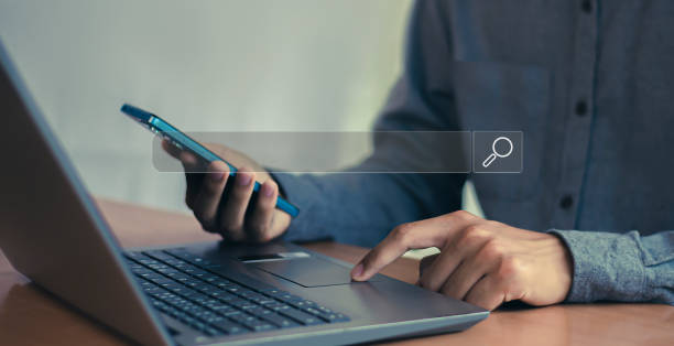 istock Searching the internet with a search bar working on a smartphone, internet network concept. 2180165499