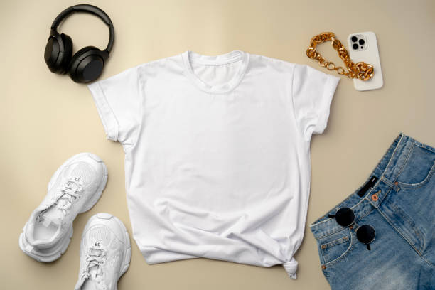 istock White T-shirt, jeans and sneakers on beige background 2180168628