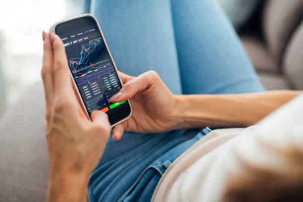 istock Businesswoman selling cryptocurrencies through a mobile app. 2180171656