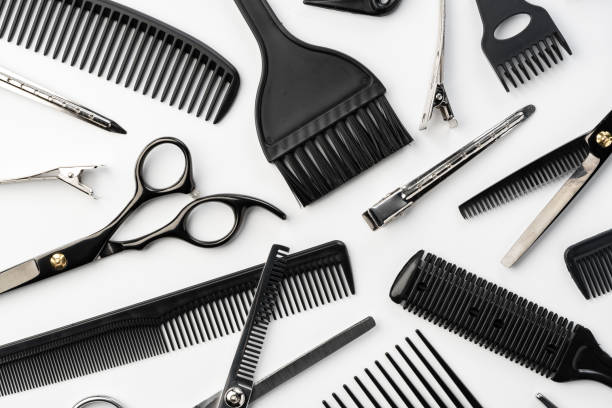 istock Black hairdressing tools and various hairbrushes on white background 2180172164