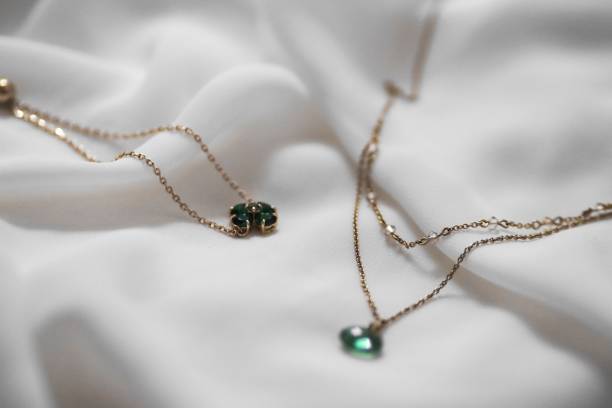 istock Elegant Gold Necklaces with Emerald Gems 2180173740