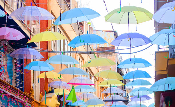 Multi colored umbrellas on street in Greece