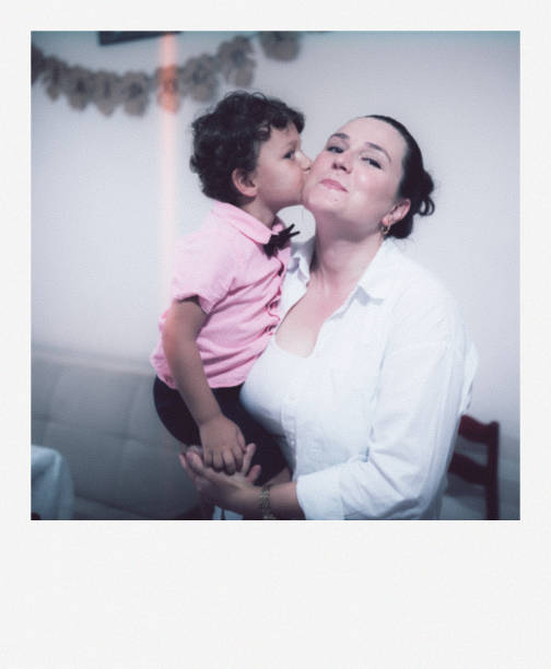 istock Son Kissing His Mother on His Birthday 2180182079