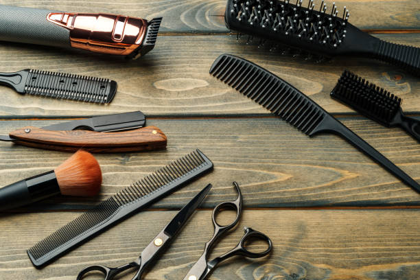 istock Set of professional barber tools on wooden table 2180184994