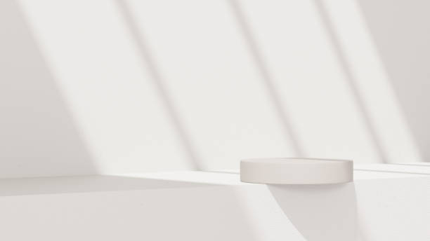 istock Minimalistic, simple, and light background for product presentation. Streaming sunlight casts soft shadows from a window onto a white-gray wall and floor, creating a clean and elegant atmosphere. 2180185433