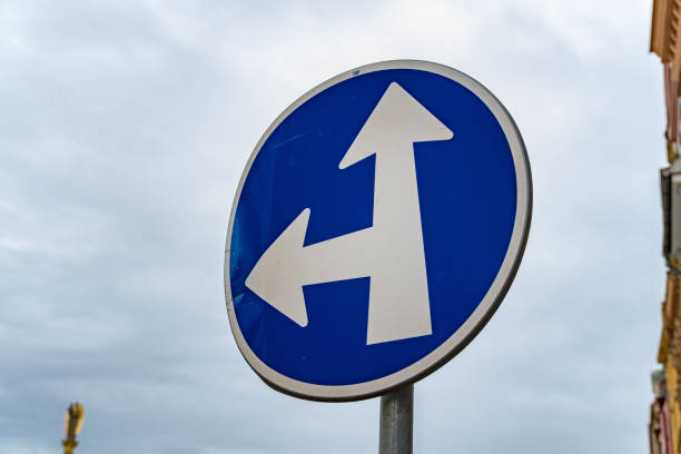 istock Directional road sign indicating multiple routes for vehicles at an intersection in Czechia during cloudy weather 2180187779