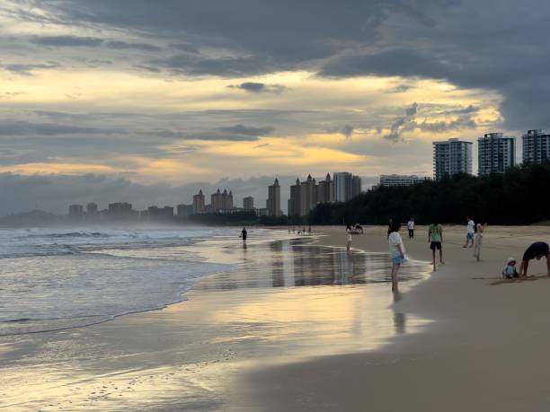 istock Serene sunset at a city beach with skyscrapers. 2180189793
