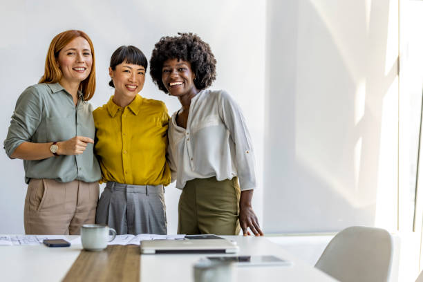istock Diverse Group of Smiling Women in Modern Office Setting 2180193537