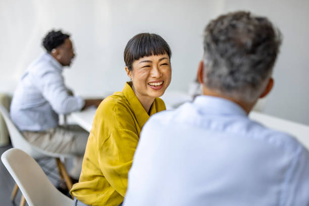 istock Business Colleagues Engaging in a Positive Office Discussion 2180193541