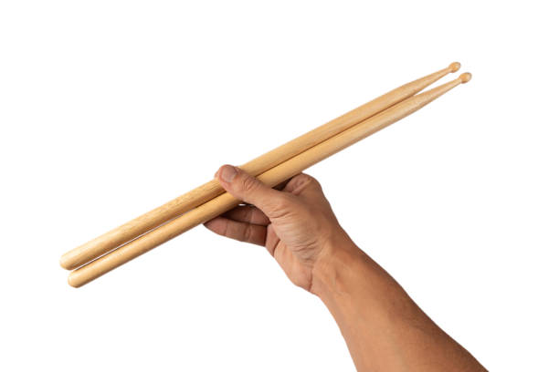 istock Male hands holding a pair of drum sticks isolated on white background 2180194500