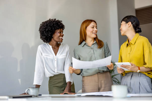 istock Diverse Group of Women Collaborating in Modern Office 2180196345
