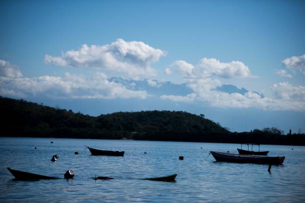 istock Serene lake scene with boats 2180196429