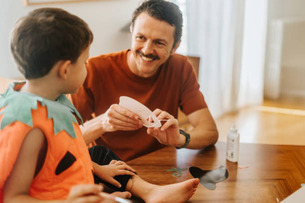 istock Family making masks for halloween 2180197310