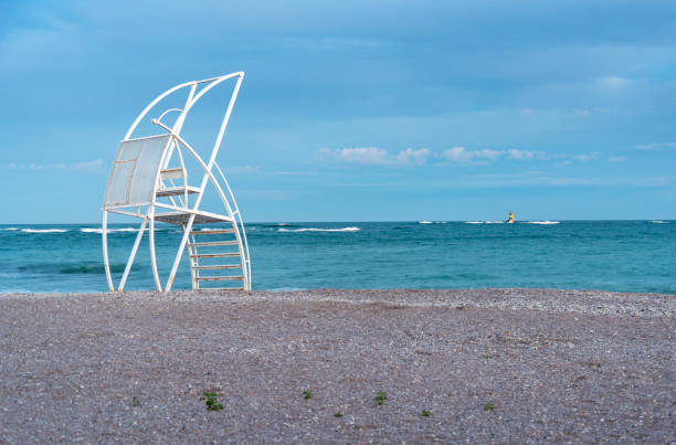 Lifeguard stand and small lighthouse during the autumn at Promorie's beach. Bulgaria, Eastern Europe.