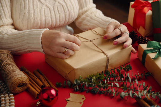 istock Wrapping Gifts for Holiday Celebration with Care 2180201737