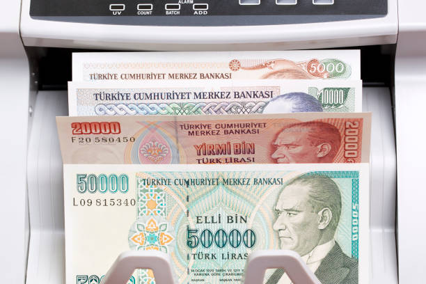 istock Old Turkish Lira in the counting machine 2180204337