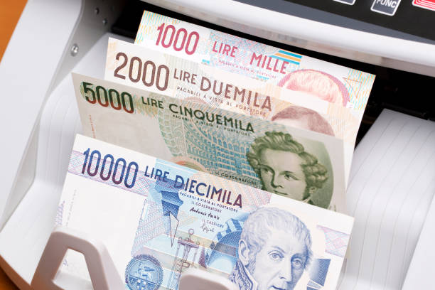istock Italian lira in the counting machine 2180204385