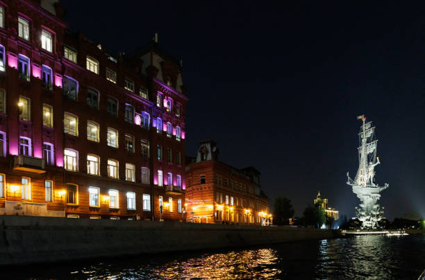 Moscow, Russia, September 28, 2023: The Moskva River at night with illuminated statue of Peter the Great and architecture