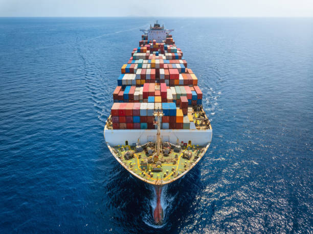 Aerial front view of a big cargo container carrier ship