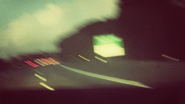 istock Nighttime road photos with slow shutter speed motion blur. 2180209046