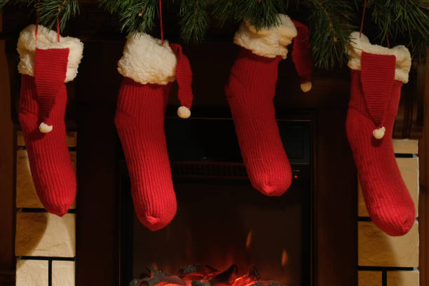 istock Christmas stockings hanging over fireplace. 2180210643